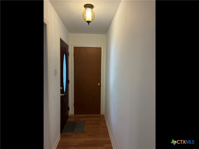 105 Brentwood Pl, Port Lavaca, TX 77979 - hall featuring wood finished floors and baseboards