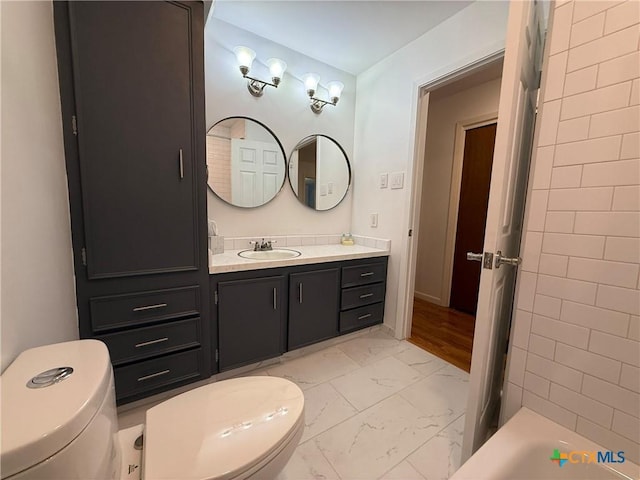 105 Brentwood Pl, Port Lavaca, TX 77979 - bathroom featuring marble look tiles and vanity