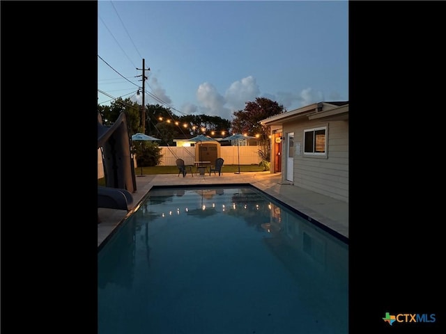 105 Brentwood Pl, Port Lavaca, TX 77979 - view of swimming pool featuring a water slide, a patio area, and a fenced backyard