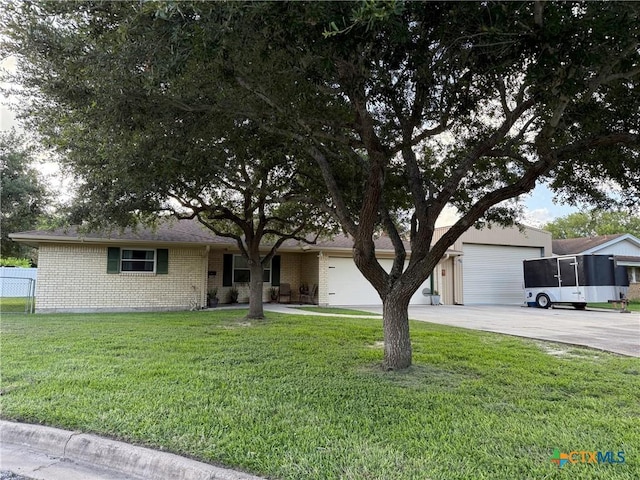 105 Brentwood Pl, Port Lavaca, TX 77979 - ranch-style home with concrete driveway, brick siding, and an attached garage