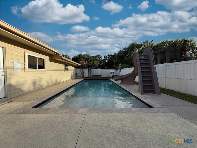 105 Brentwood Pl, Port Lavaca, TX 77979 - view of swimming pool featuring a water slide, a fenced backyard, a patio, and stairs