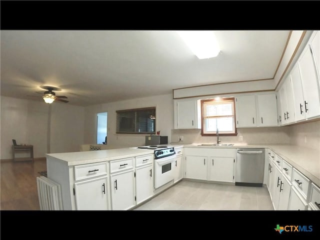 105 Brentwood Pl, Port Lavaca, TX 77979 - kitchen with stainless steel dishwasher, white electric stove, a peninsula, light countertops, and white cabinets