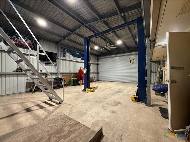 105 Brentwood Pl, Port Lavaca, TX 77979 - garage featuring ceiling fan and metal wall