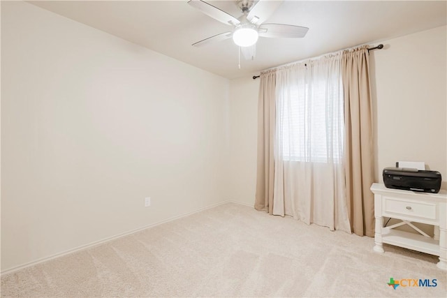 carpeted empty room with ceiling fan