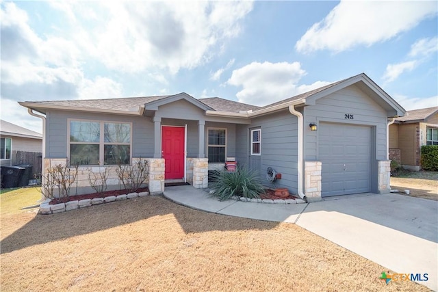 ranch-style home featuring a garage