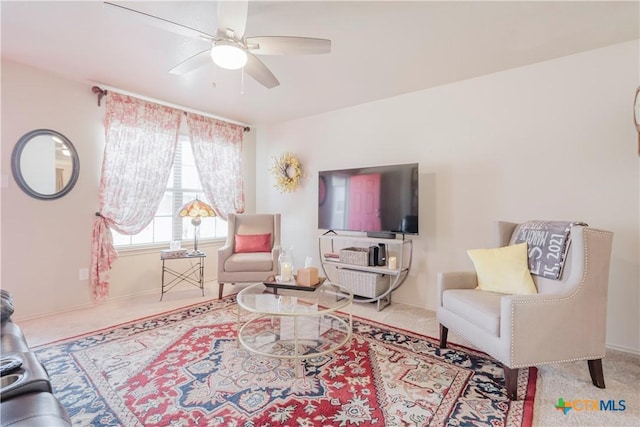 living room with light colored carpet and ceiling fan