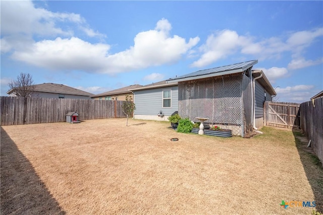 back of house with a yard