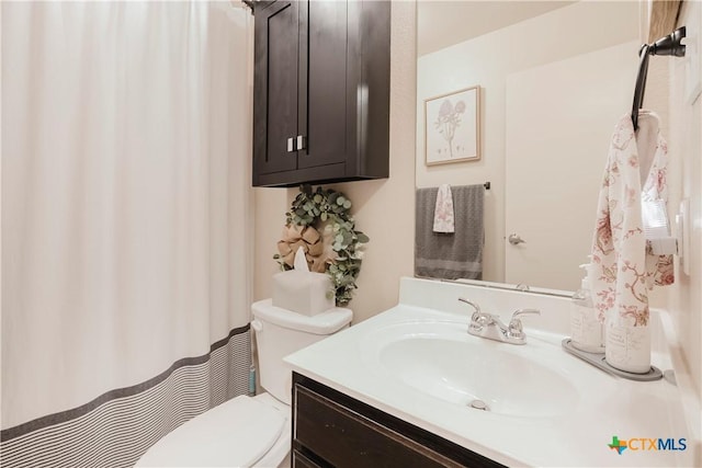 bathroom with vanity and toilet