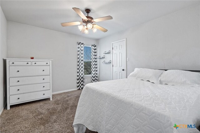 bedroom with baseboards, carpet, and a ceiling fan