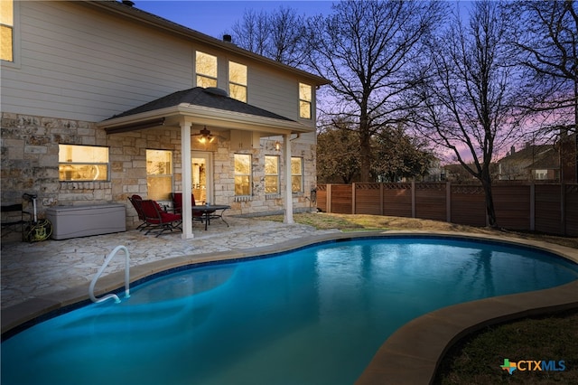 view of pool featuring a patio, fence, and a fenced in pool