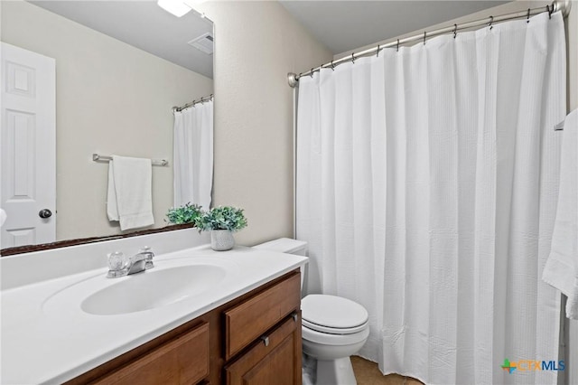 full bath with visible vents, toilet, and vanity