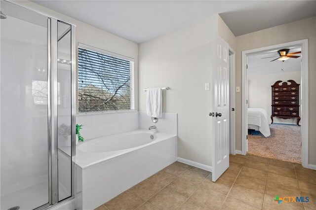 ensuite bathroom featuring ensuite bath, a bath, a shower stall, and tile patterned flooring