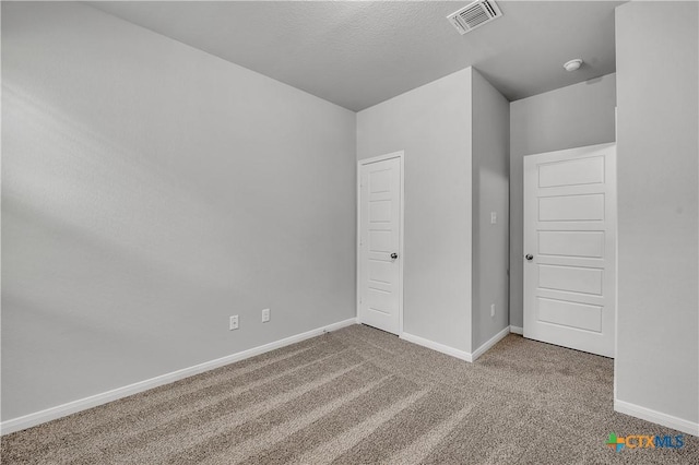 unfurnished bedroom featuring carpet