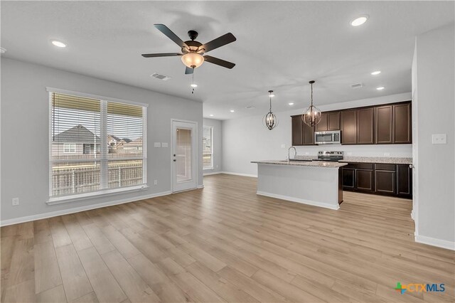 carpeted spare room with a textured ceiling and ceiling fan