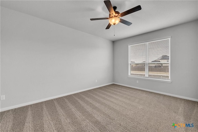 empty room featuring carpet flooring and ceiling fan