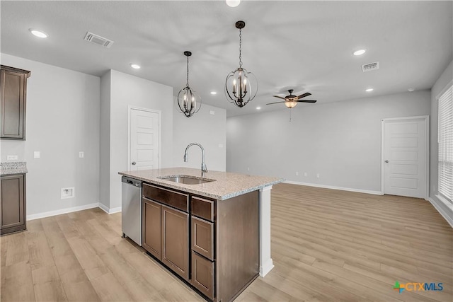 kitchen with dishwasher, sink, light stone counters, dark brown cabinets, and light wood-type flooring