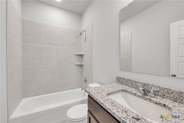 full bathroom with tiled shower / bath combo, vanity, and toilet