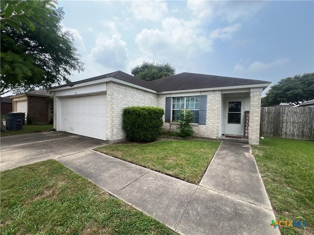 316 Clydesdale Ln, Victoria, TX 77904 - single story home featuring brick siding, an attached garage, and driveway