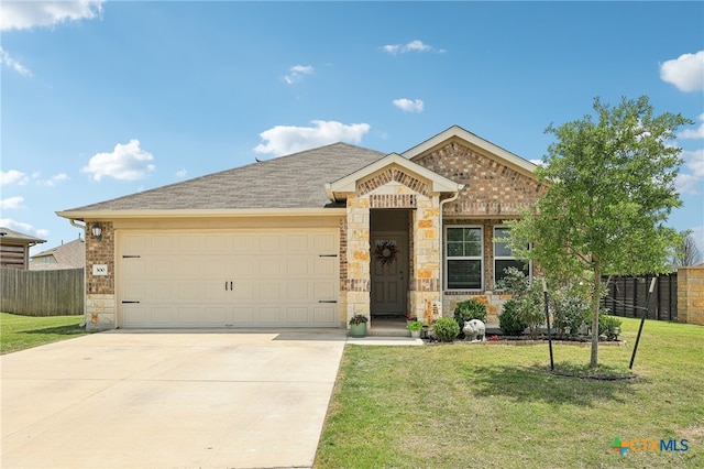 300 Golden Plains Pkwy, Hutto, TX 78634 - single story home with stone siding, an attached garage, concrete driveway, and a shingled roof