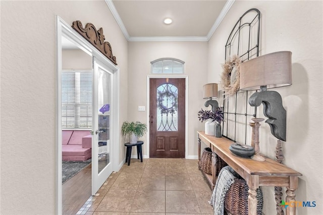 tiled entrance foyer with crown molding