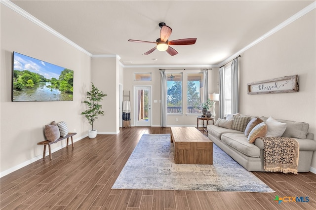 living room with crown molding, ceiling fan, and dark hardwood / wood-style floors