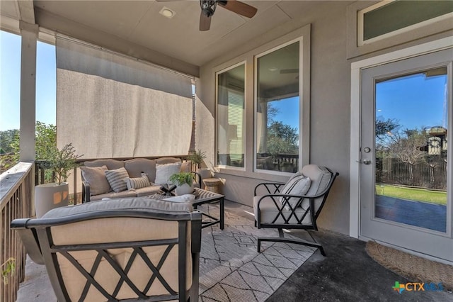 balcony with an outdoor living space and ceiling fan