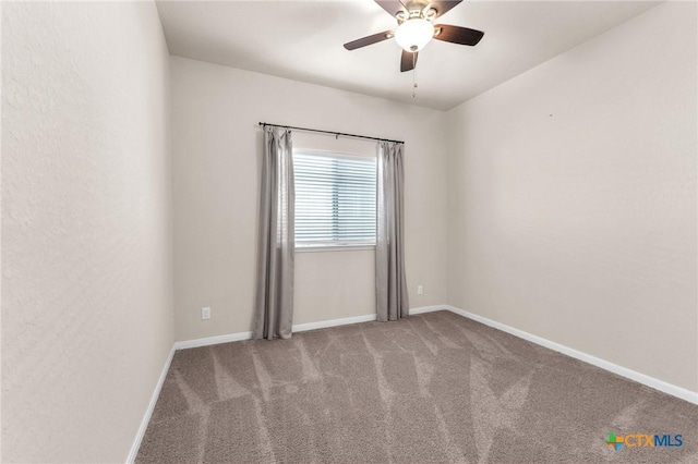 empty room with ceiling fan and carpet