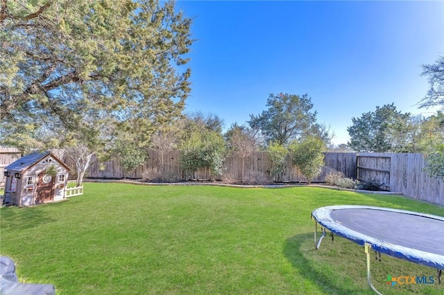 view of yard with a trampoline