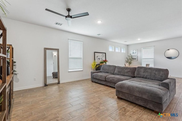 8409 Glade Dr, Temple, TX 76502 - living area with light wood finished floors, ceiling fan, and recessed lighting
