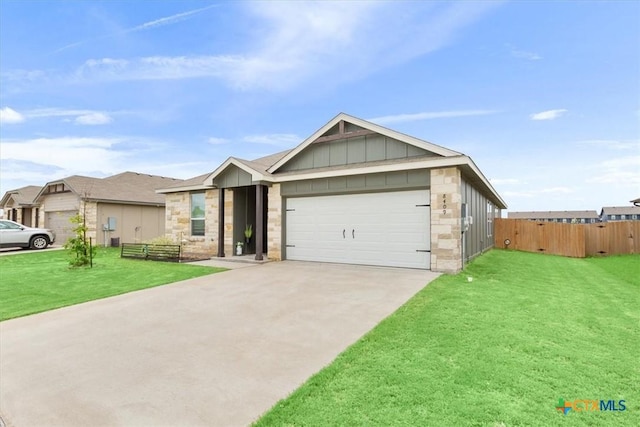 8409 Glade Dr, Temple, TX 76502 - view of front of property featuring board and batten siding, driveway, an attached garage, and stone siding