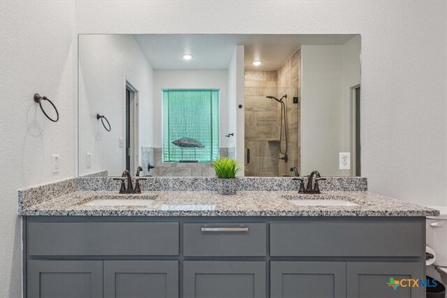 8409 Glade Dr, Temple, TX 76502 - full bathroom featuring a tile shower and double vanity