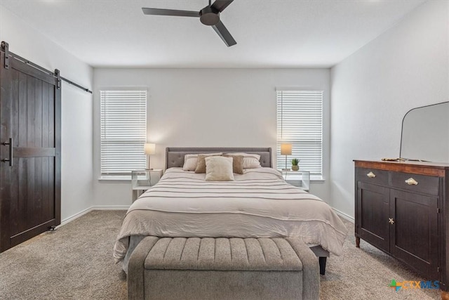 8409 Glade Dr, Temple, TX 76502 - bedroom with a barn door, carpet floors, and ceiling fan