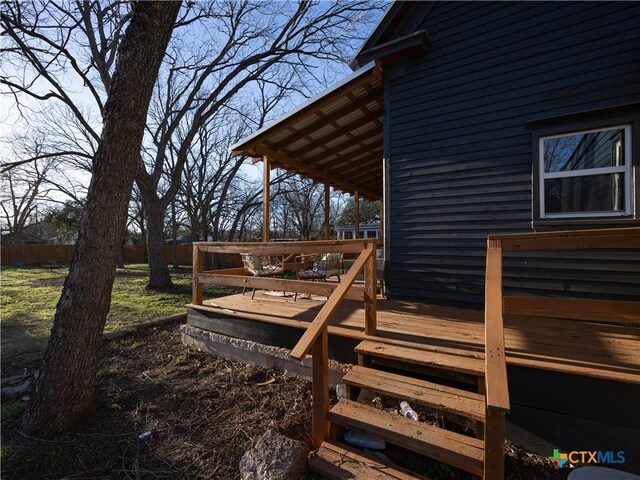 wooden deck featuring fence