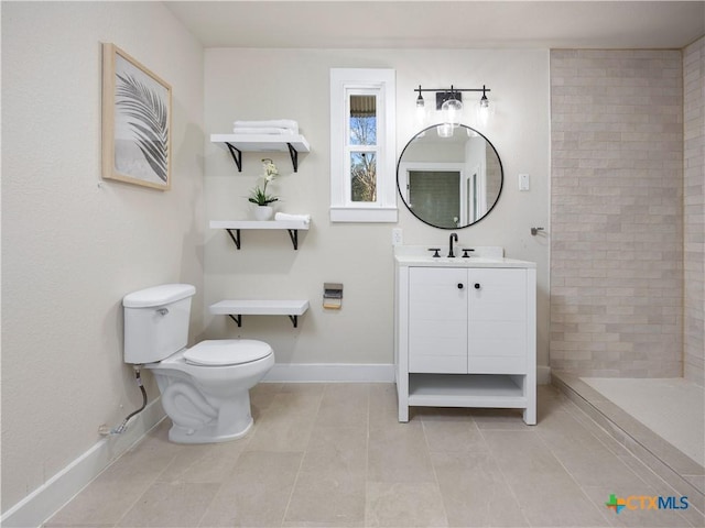 full bath featuring baseboards, toilet, a tile shower, tile patterned floors, and vanity