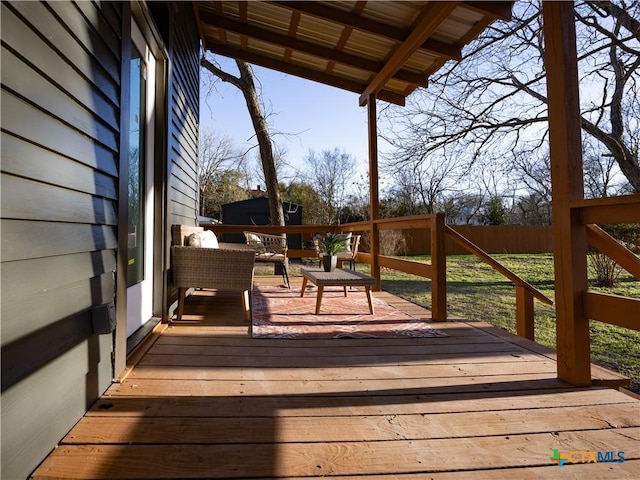 wooden deck featuring fence