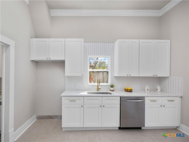 kitchen featuring a sink, stainless steel dishwasher, white cabinets, light tile patterned flooring, and baseboards