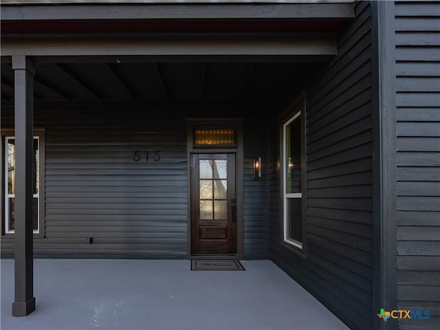 entrance to property with a porch