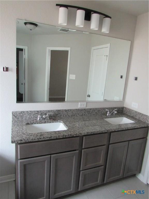 10018 Kensley Rose Dr, Killeen, TX 76542 - bathroom with double vanity and tile patterned floors