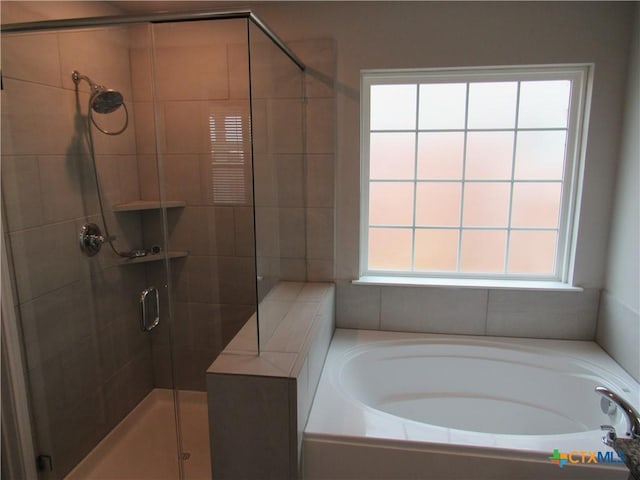 10018 Kensley Rose Dr, Killeen, TX 76542 - full bath featuring a stall shower, a bath, and healthy amount of natural light