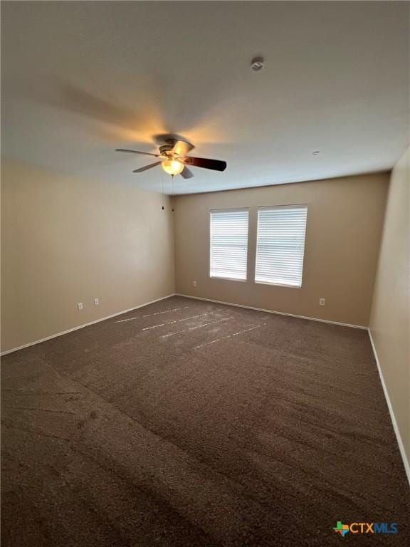 9109 Bellgrove Ct, Killeen, TX 76542 - empty room with baseboards, dark carpet, and ceiling fan