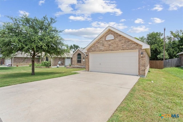 215 Sheridan Loop, Belton, TX 76513 - view of front facade featuring brick siding, driveway, and a garage