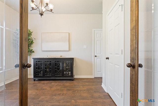 215 Sheridan Loop, Belton, TX 76513 - hall featuring a chandelier and dark wood-type flooring