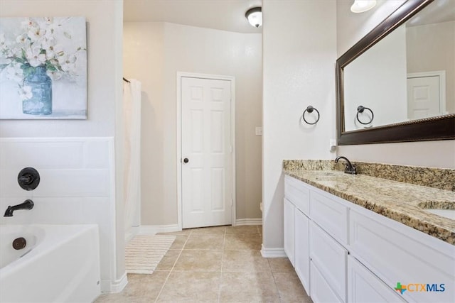 215 Sheridan Loop, Belton, TX 76513 - bathroom with a tub, double vanity, tile patterned flooring, and a shower with shower curtain