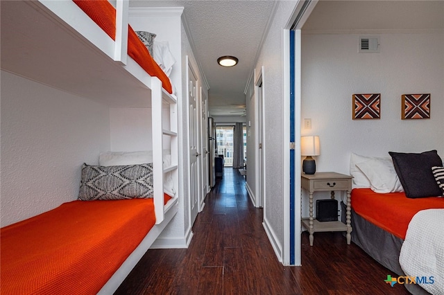 3938 Surfside Blvd Unit 3116, Corpus Christi, TX 78402 - corridor featuring wood finished floors, baseboards, and a textured wall