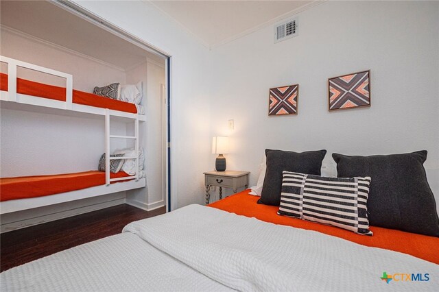 3938 Surfside Blvd Unit 3116, Corpus Christi, TX 78402 - bedroom featuring crown molding and wood finished floors
