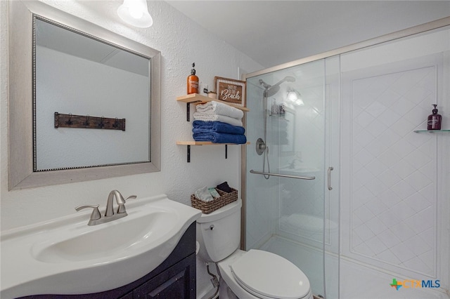 3938 Surfside Blvd Unit 3116, Corpus Christi, TX 78402 - bathroom with vanity, a stall shower, toilet, and a textured wall