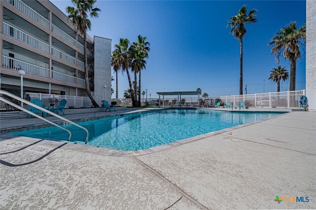 3938 Surfside Blvd Unit 3116, Corpus Christi, TX 78402 - community pool featuring a patio area