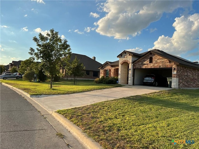 view of front of house featuring a garage and a front lawn