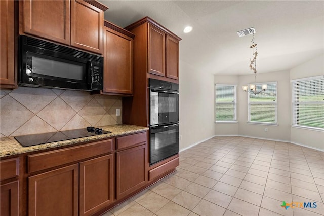 kitchen featuring tasteful backsplash, plenty of natural light, light stone countertops, and black appliances