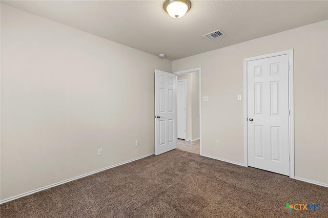 unfurnished bedroom featuring carpet flooring